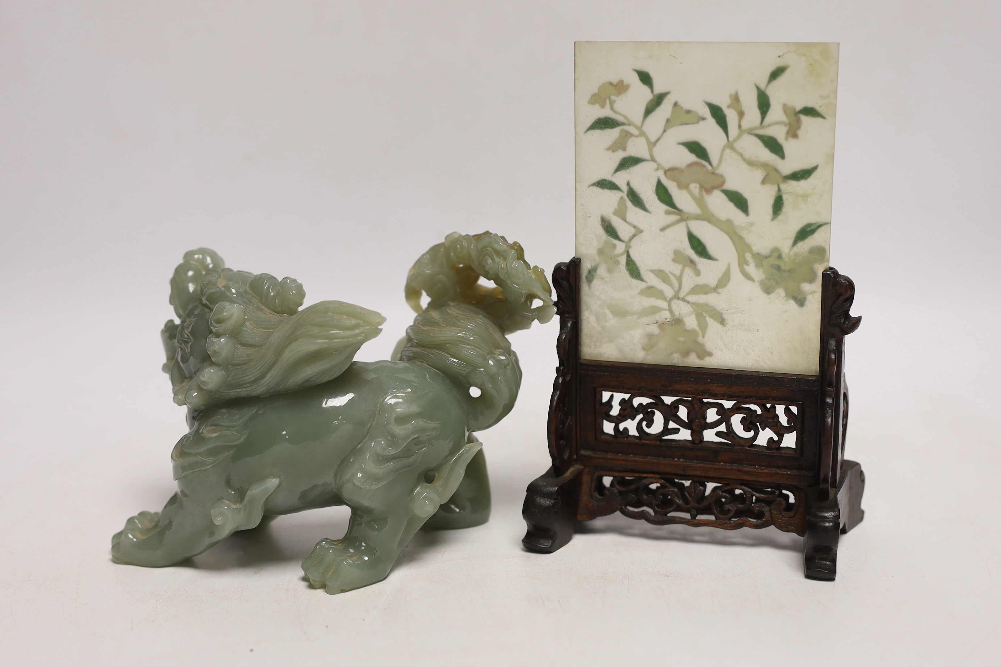 An early 20th century Chinese hardstone, lapis lazuli, coral and hardwood table screen together with a Chinese green jade lion dog, tallest 18cm